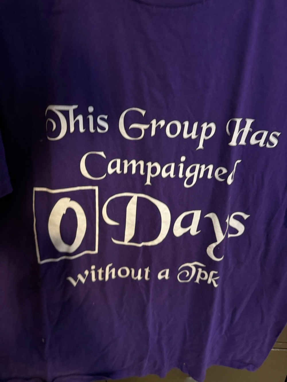 D&D  TTRPG Purple Graphic Tee — "This Group Has Campaigned 0 Days without a TPK"